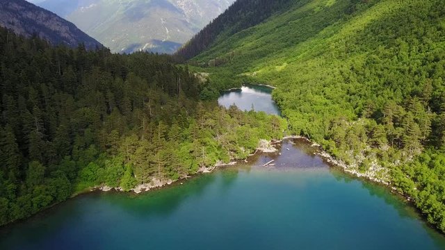 Lake in the mountain valley. Beautiful natural video from air