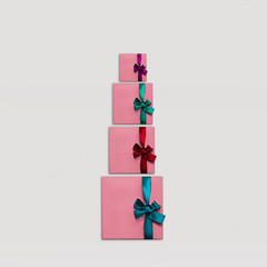 Gift boxes Top view Many stylish pink gift boxes with colorful bright ribbons on white background Photo mockup with space for text