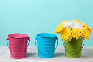 Spring background with flowers and buckets