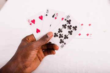 Hand with poker cards