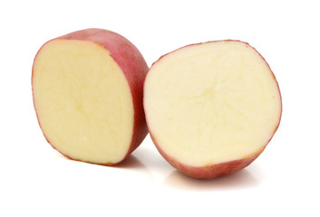 Close up of two red potatoes against white background. 