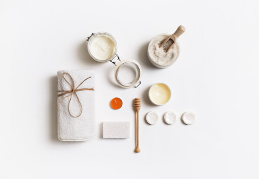 Spa branding template. Beauty and spa threatment products on white paper background. Flat lay.