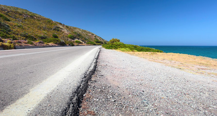 Road on a sea shore. Greece, Rhodes.