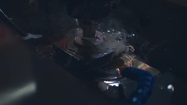 Electrical discharge wire cutting. Slow motion, high speed camera, 250fps