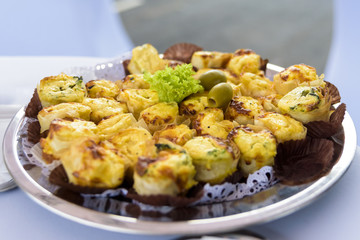 salted delicious canapés served on a plate