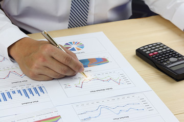 Businessman analyzing Summary report and financial  order market plan