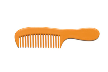 Orange comb is placed on a white background.
