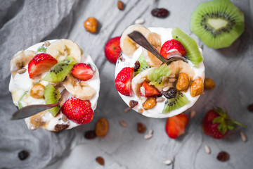 Nutrition Yoghurt fruit dessert strawberries banana kiwi raisins sunflower seeds oatmeal walnuts caramel