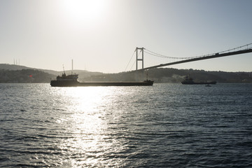 A view of bosphorus Istanbul and big ships passing by the bridge