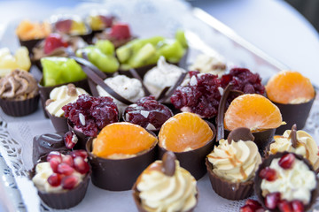 sweet delicious canapés served on a plate