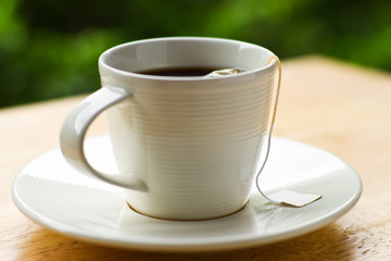 A cup of tea on the table in the garden