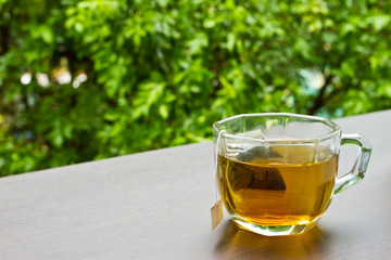 A cup of tea on the table in the garden