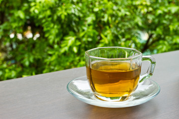 A cup of tea on the table in the garden