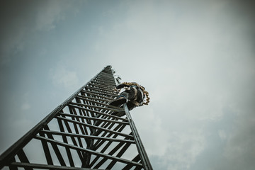 Telecom Worker Climbing Antenna Tower