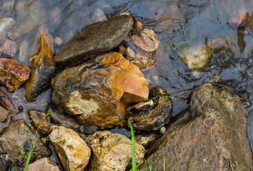 wet river stone. texture natural shore background base