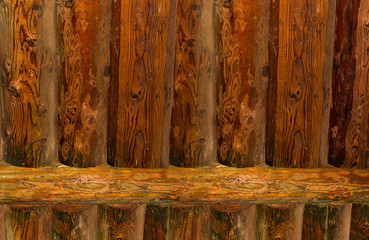 Wall pine log, background fence natural texture with patina, vertical lines with cross bar
