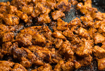 sliced fried with meat sauce close-up, pork strips barbecue way of cooking dishes