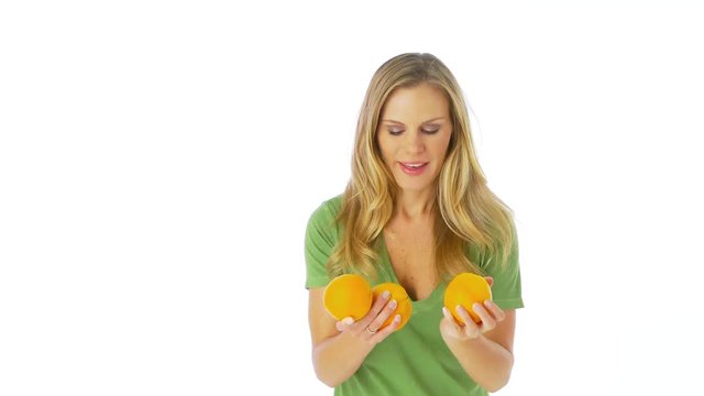 Woman juggling oranges