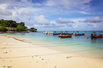 Fototapeta na wymiar Wooden thai boats near phiphi island border in Thailand