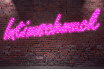 Leuchtreklame Intimschmuck an Ziegelsteinmauer