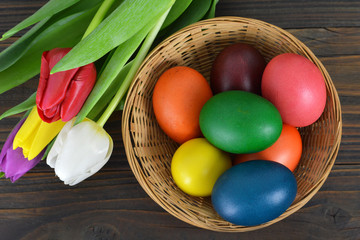 Easter basket with colorful Easter eggs