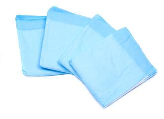 Medium size blue under pads for adults isolated on white background