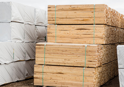 Horizontal Image Of A Pile Of Lumber Stacked And Tied Together.