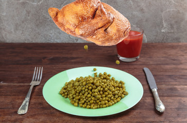 delicious smoked chicken with Golden skin flying over the plate