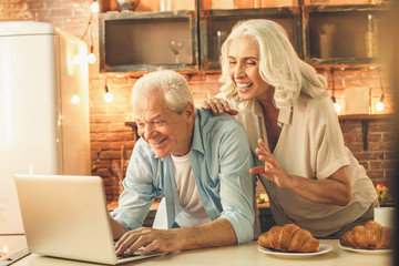 Senior couple cooking together at home love