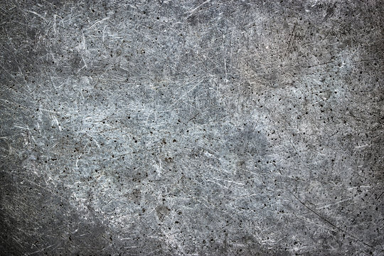 Gray metal texture in scratches and abrasions