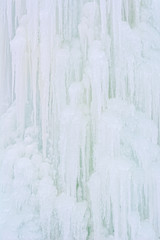 Ice background with texture icicles, white and blue background