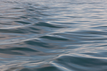 Natural water texture: abstract image of ripples of water in the ocean..