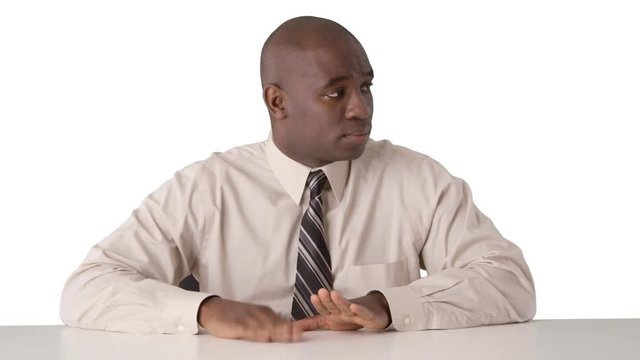 African American businessman drumming on desk
