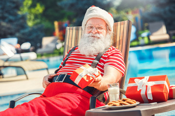 Santa Claus near the pool holiday vacation concept