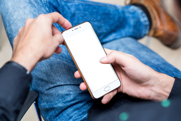 a young man hold smartphone in hand.