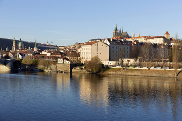 Fototapeta na wymiar View on the winter Prague gothic Castle above River Vltava in the sunny Day, Czech Republic