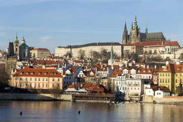 Naklejka na ściany i meble View on the winter Prague gothic Castle above River Vltava in the sunny Day, Czech Republic