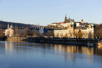 Fototapeta na wymiar View on the winter Prague gothic Castle above River Vltava in the sunny Day, Czech Republic