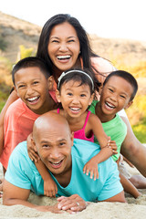 Happy family playing on the beach.