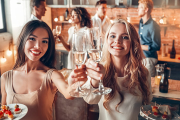 Group of friends party together indoors celebration