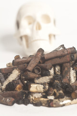 Skull and cigarette butts.Smoking kills