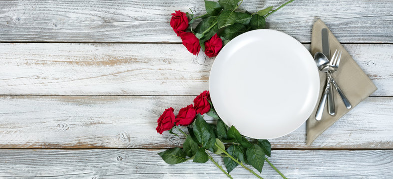 Valentine Dinner table setting on rustic wood background