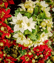 Poinsettia Christmas decorations for sale in a store, UK