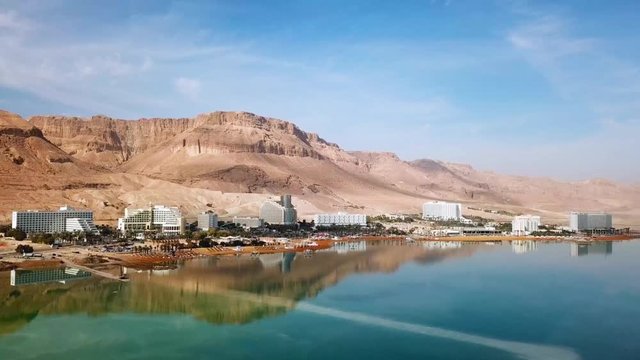 Aerial footage of the Dead Sea hotels and beaches area, flying above the salty water