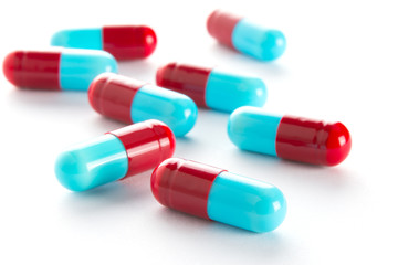 capsules of medicine on white background