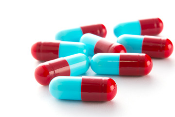 capsules of medicine on white background