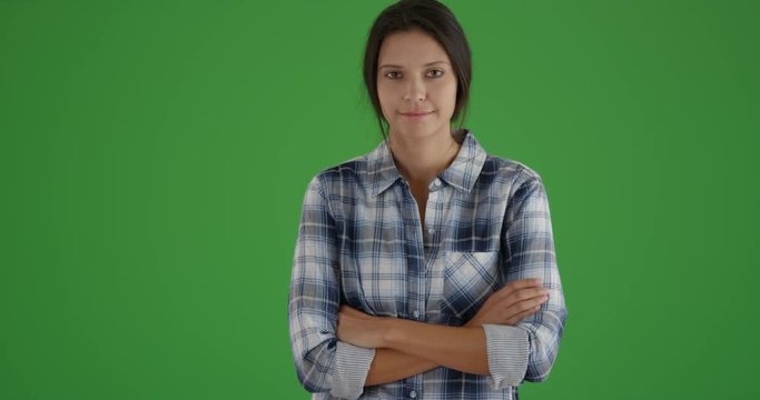 Millennial white girl poses for a portrait in plaid on green screen. On green screen to be keyed or composited. 