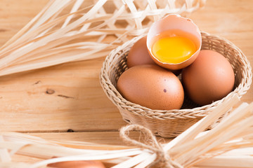 Organic eggs and broken egg on wood. Fresh eggs.