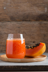 Fresh papaya smoothie juice in glass