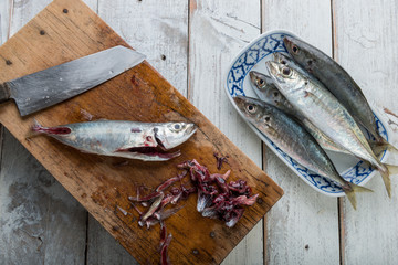 Prepared mackerel fish on wooden slate